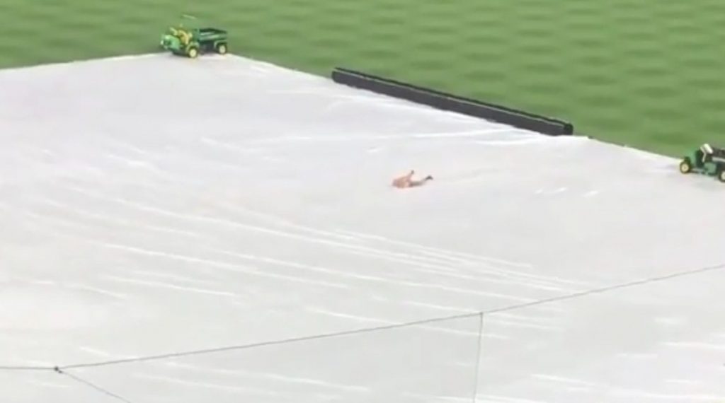 Shirtless Fan Runs On Field, Uses Tarp As Slip And Slide During