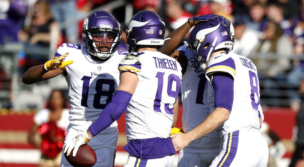 Vikings players celebrate following a touchdown.