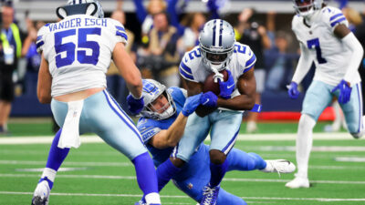 Jourdan Lewis Holding ball as he is being tackled