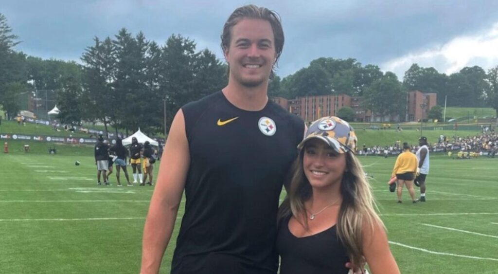 Kenny Pickett with his arm around fiance Amy Paternoster, both sporting Steelers clothing.