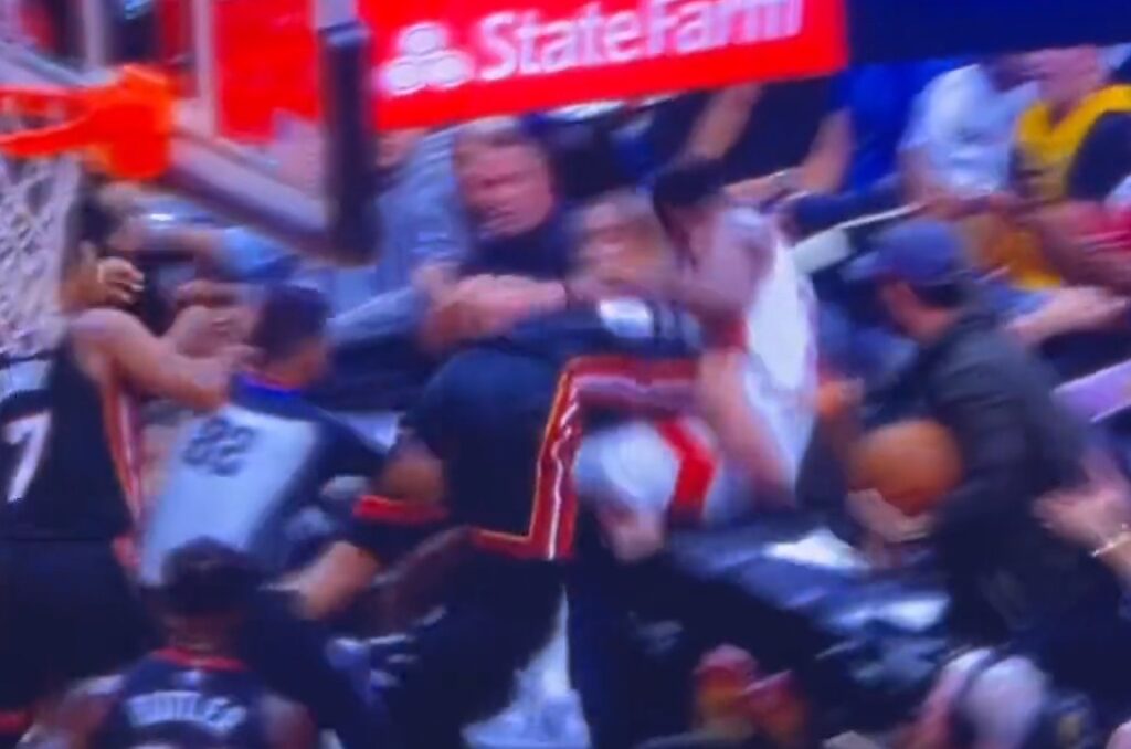 Caleb Martin slamming Christian Koloko on a chair during fight