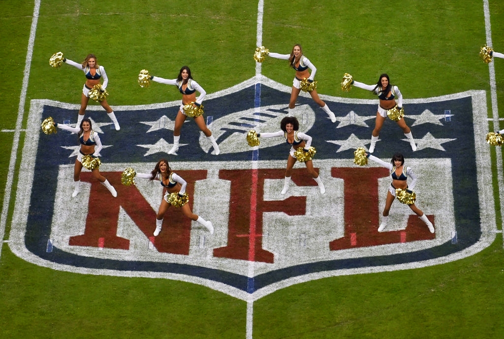 cheerleaders performing on nfl logo