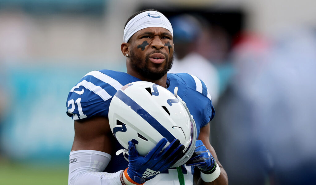 Colts running back Nyheim Hines looks on with his helmet off.