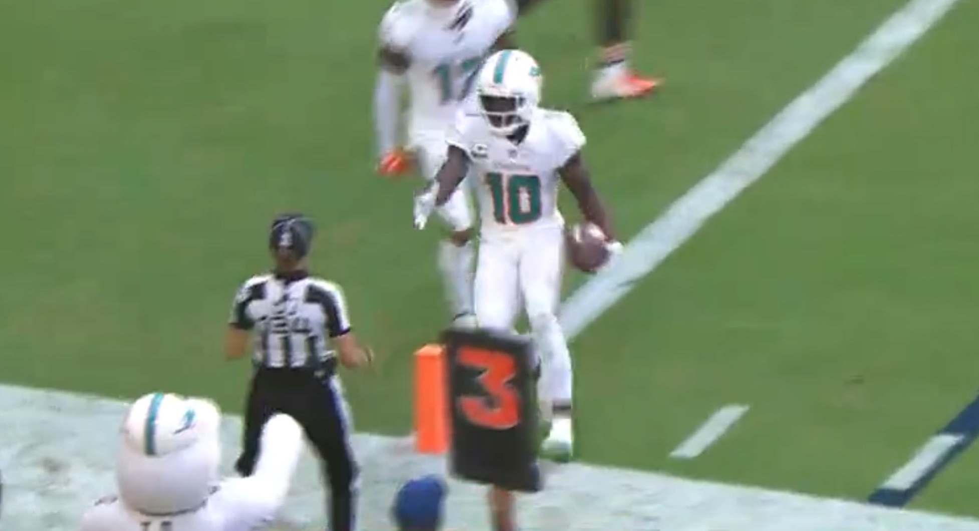 Tyreek Hill of the Miami Dolphins celebrates a touchdown catch