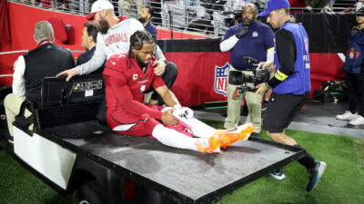 Kyler Murray getting carted off of the field after injuring his right ACL against the Patriots