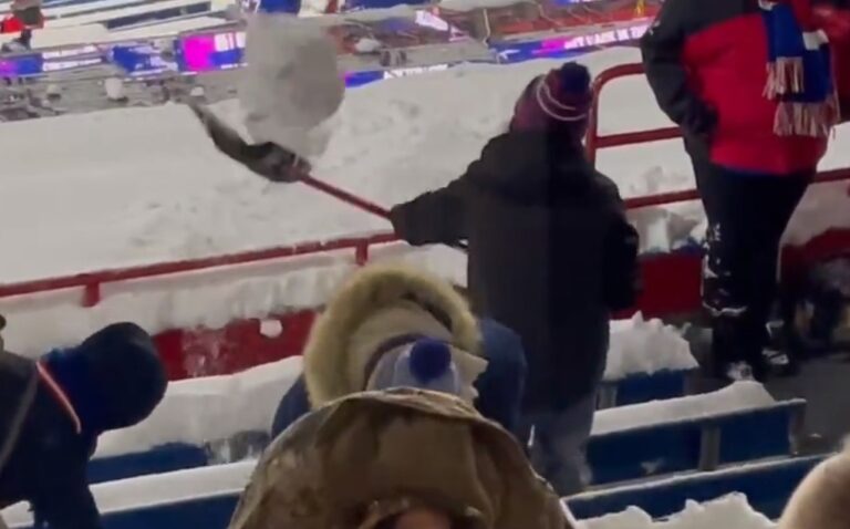 Bills Fans Dig Their Seats Out From The Snow In The Stands