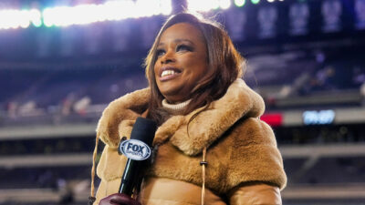 Pam Oliver with a mic in hand