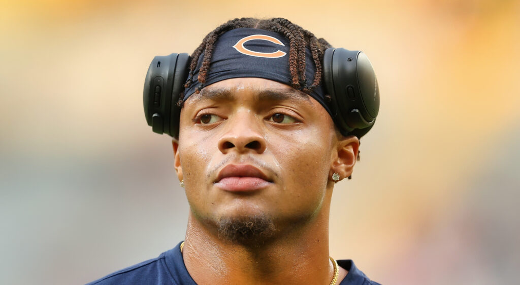 Chicago Bears' quarterback Justin Fields looking on before 2022 game.