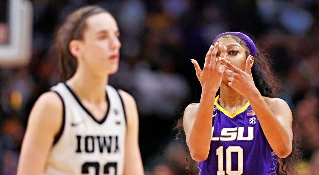 Angel Reese #10 of the LSU Lady Tigers reacts towards Caitlin Clark #22 of the Iowa Hawkeyes