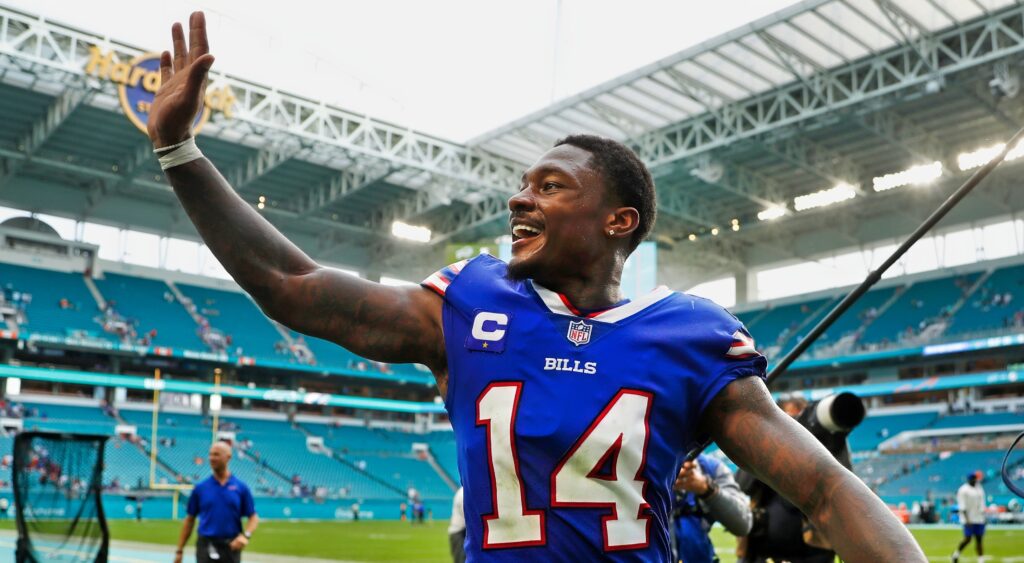 Stefon Diggs waives to the crowd after a game.