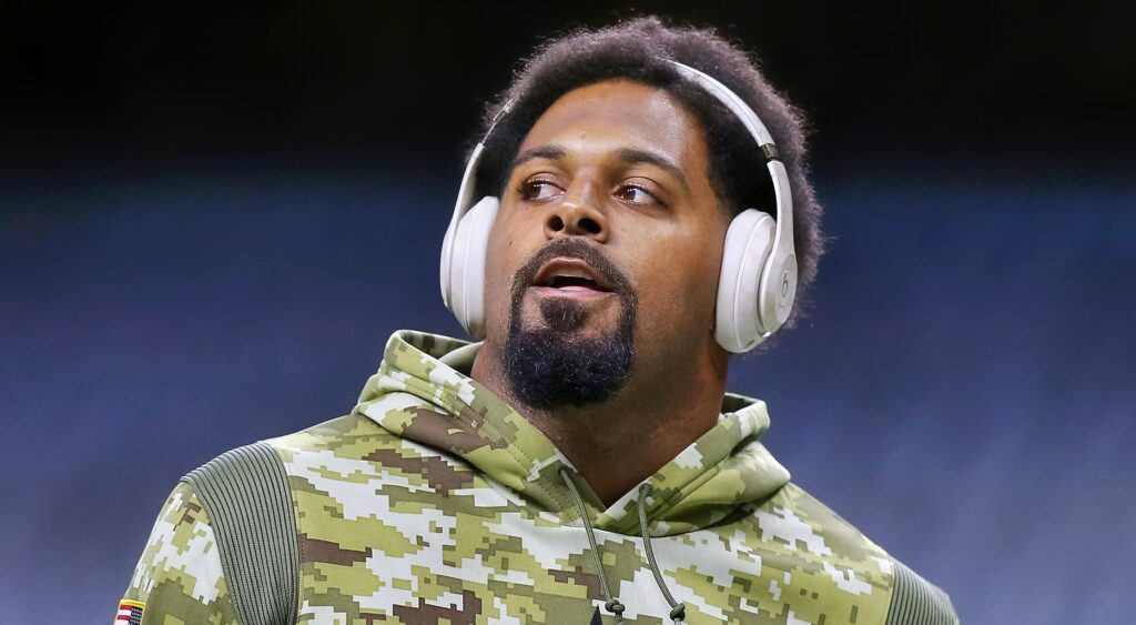 Cam Jordan with headfphones on