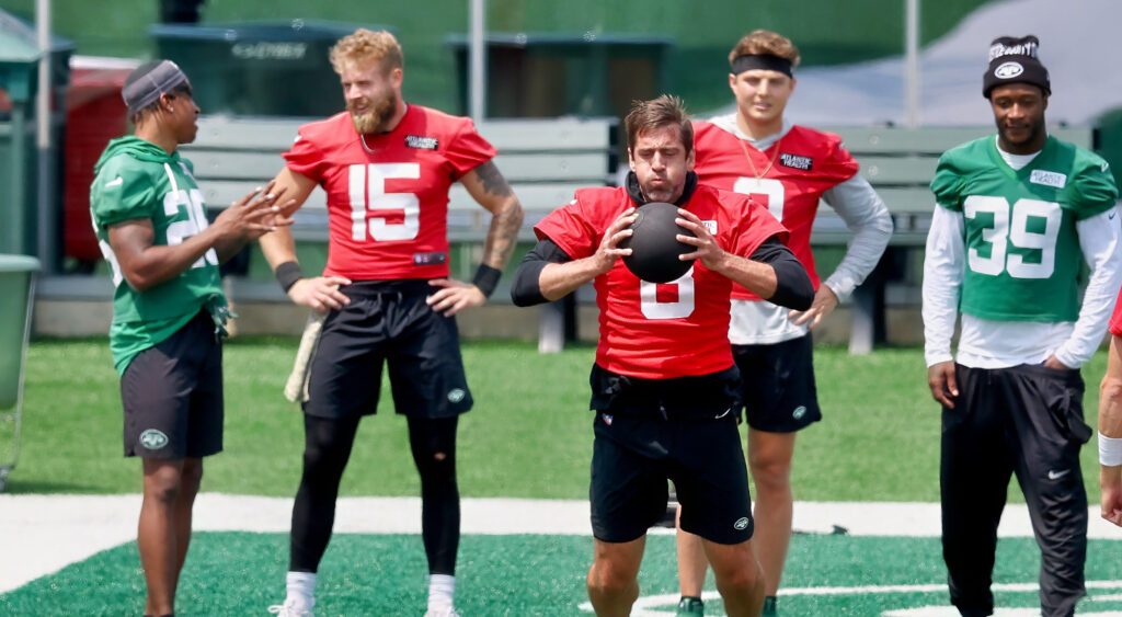 Aaron Rodgers holding medicine ball during Jets training