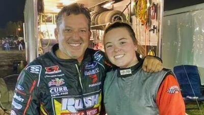 Ashlea Albertson posing with Tony Stewart