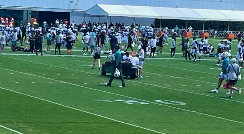 Clark Phillips III being carted off field