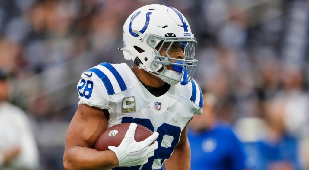 Jonathan Taylor of Indianapolis Colts running with football.