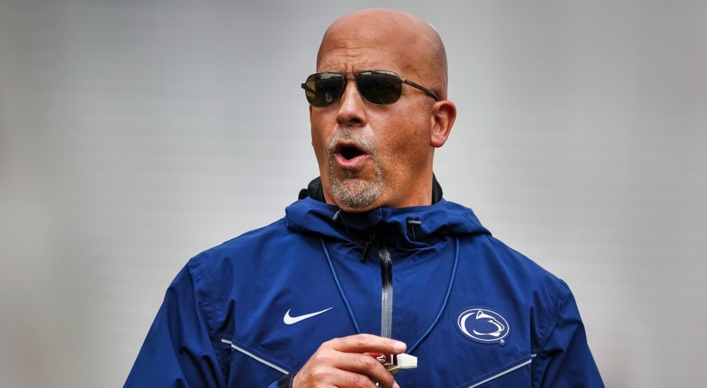 Penn State coach JAmes Franklin looks on.