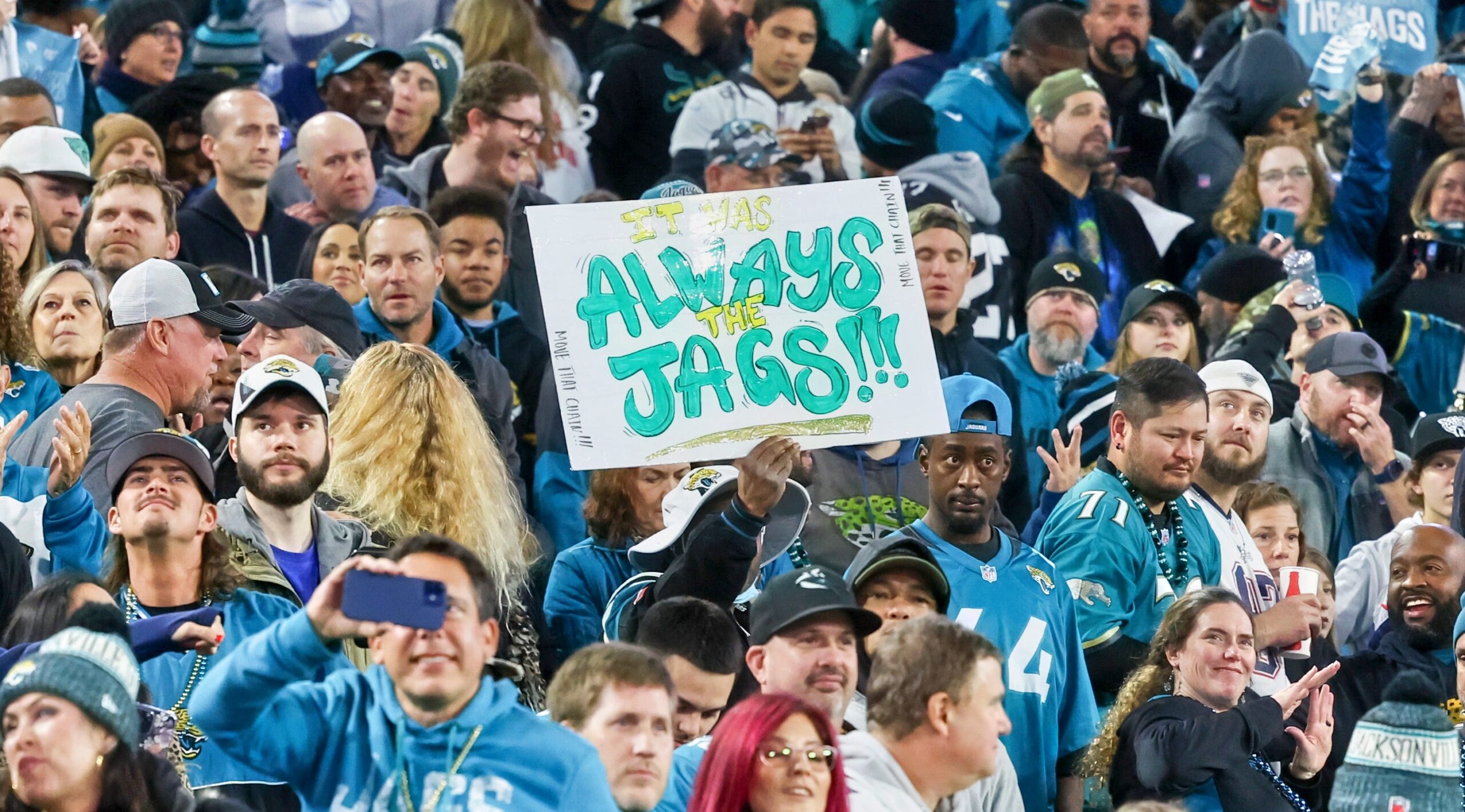 Jacksonville Jaguars fans pose for photos outside the stadium before an NFL  football game against the Tennessee Titans, Saturday, Jan. 7, 2023, in  Jacksonville, Fla. (AP Photo/Phelan M. Ebenhack Stock Photo - Alamy