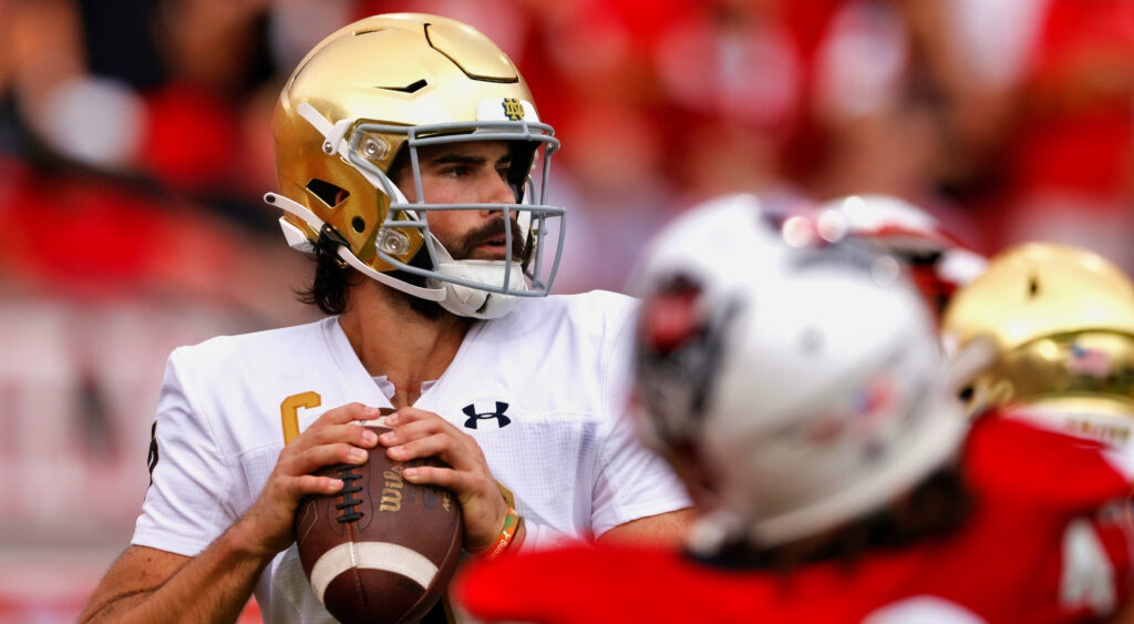 Sam Hartman throwing ball.