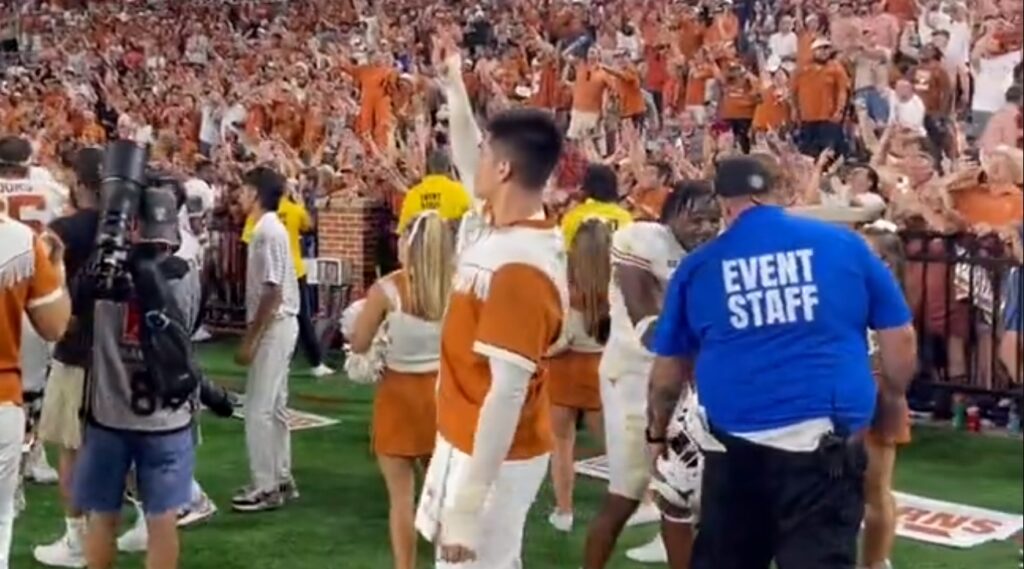 Texas Longhorns players and fans celebrate after win.