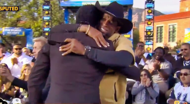 Deion Sanders and Michael Irvin hugging