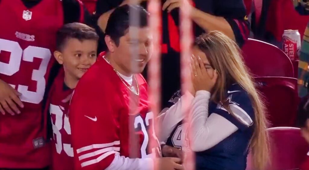 49ers and cowboys fan in stands