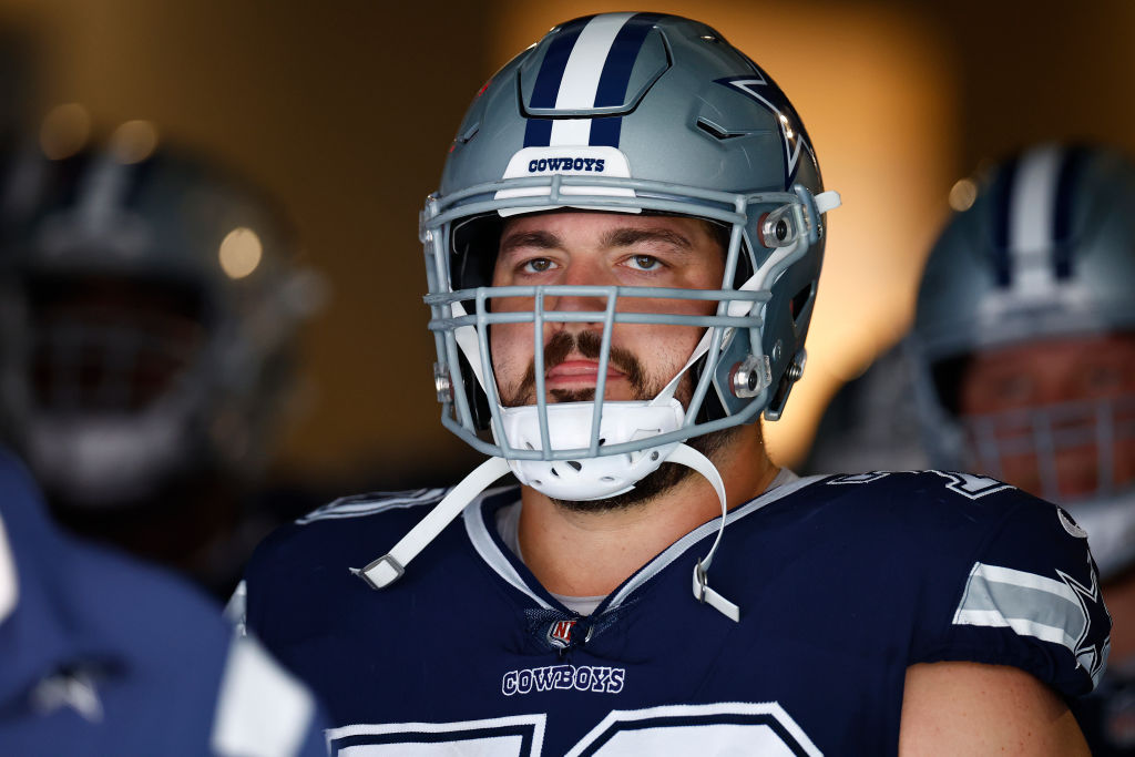 Zack Martin looking on.