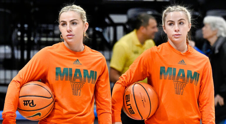 THe Cavinder Twins in in Miami Hurricanes sweaters