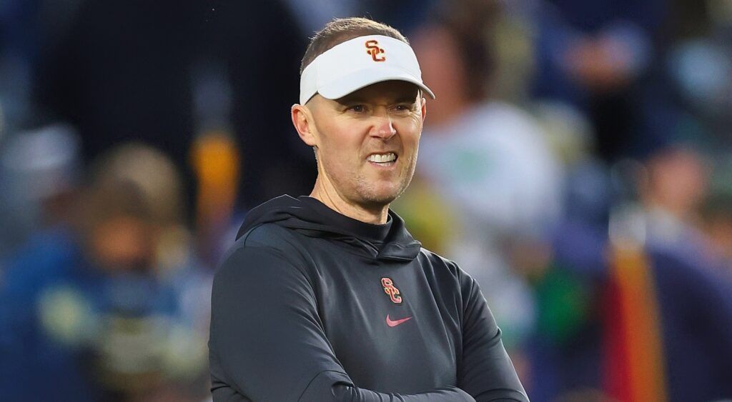 USC Trojans head coach Lincoln Riley looking on.