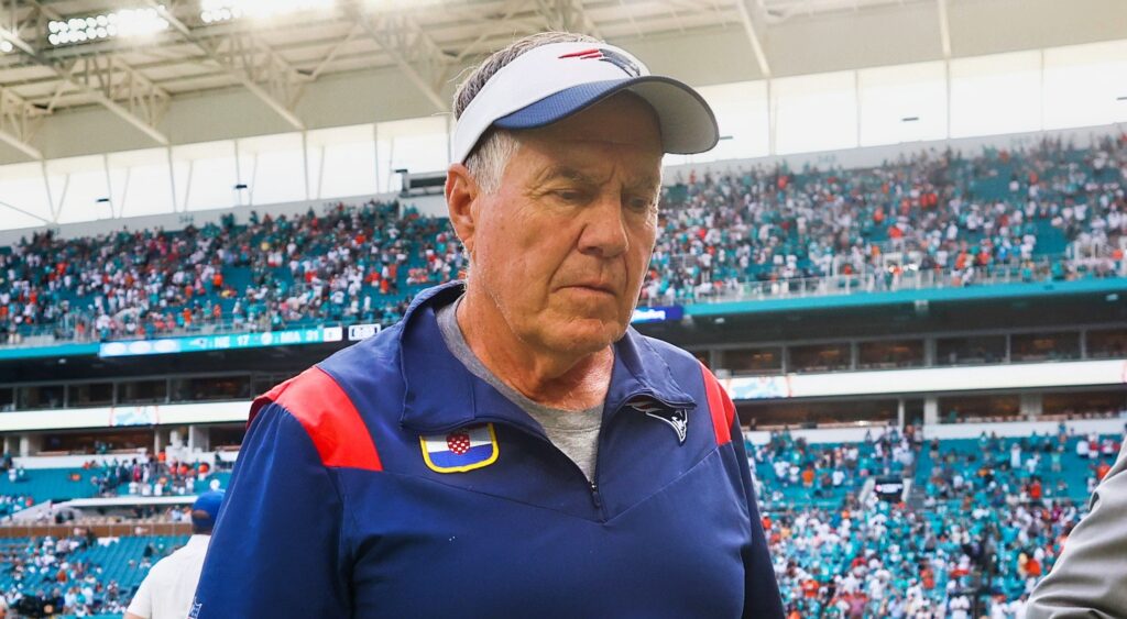 New England Patriots head coach Bill Belichick looking on.