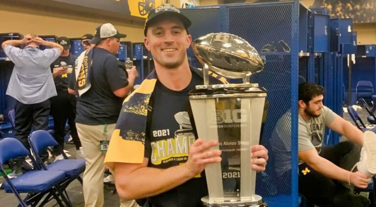 Connor Stalions holding trophy