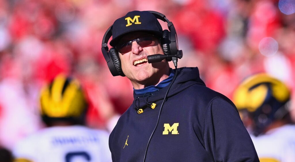 Jim Harbaugh of Michigan Wolverines looking on.