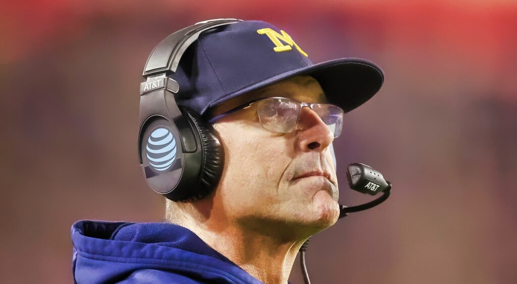 Jim Harbaugh of the Michigan Wolverines looking on during game.