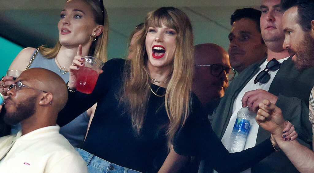 Taylor Swift holding a drink