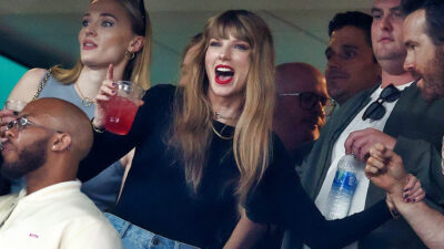 Taylor Swift holding a drink