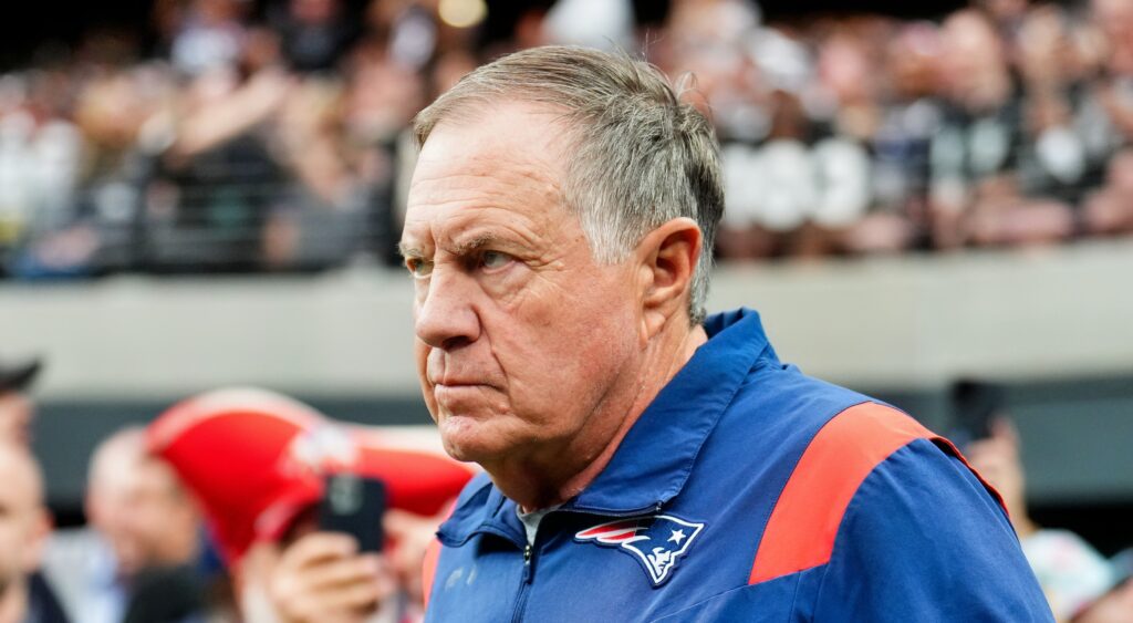 New England Patriots head coach Bill Belichick looking on.