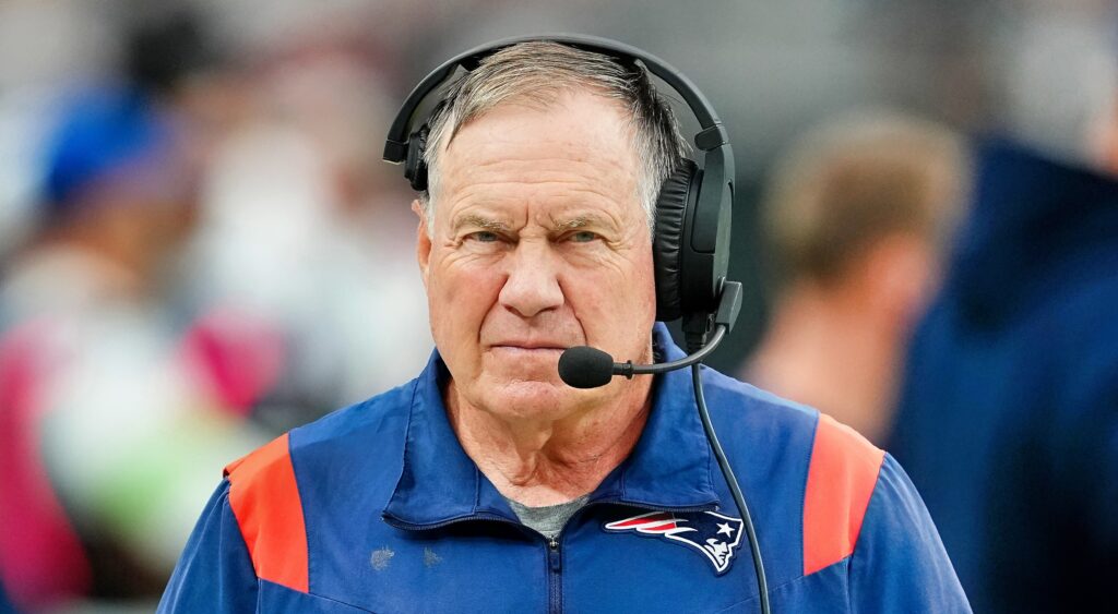 New England Patriots head coach Bill Belichick looks on.