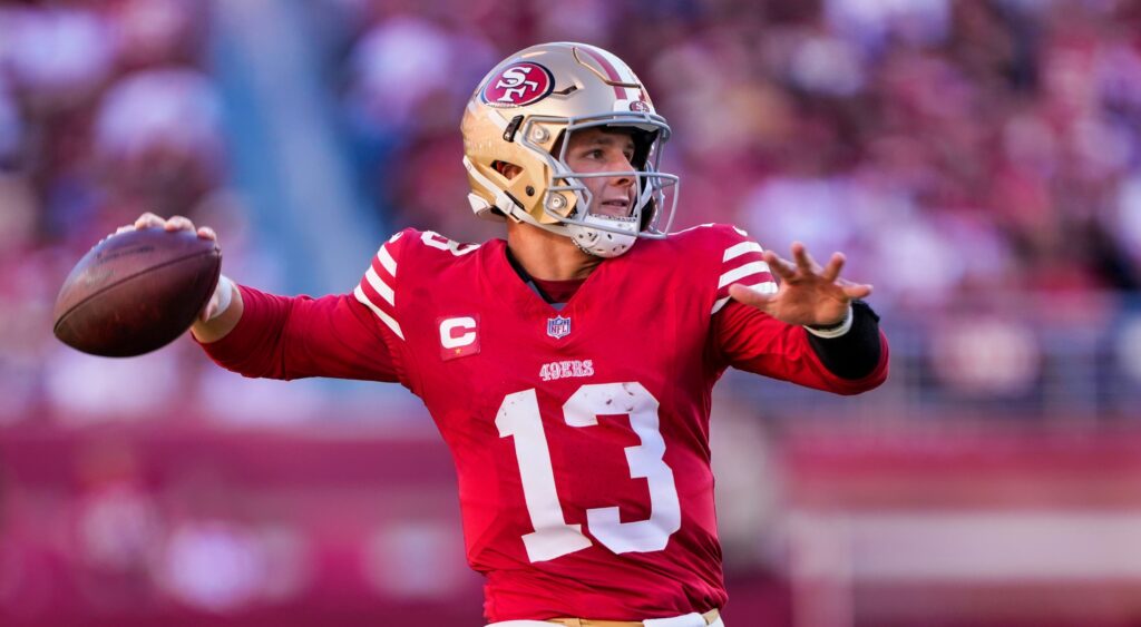 Brock Purdy of San Francisco 49ers throwing football.