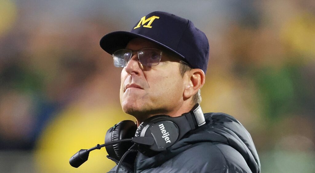 Jim Harbaugh wearing Michigan hat