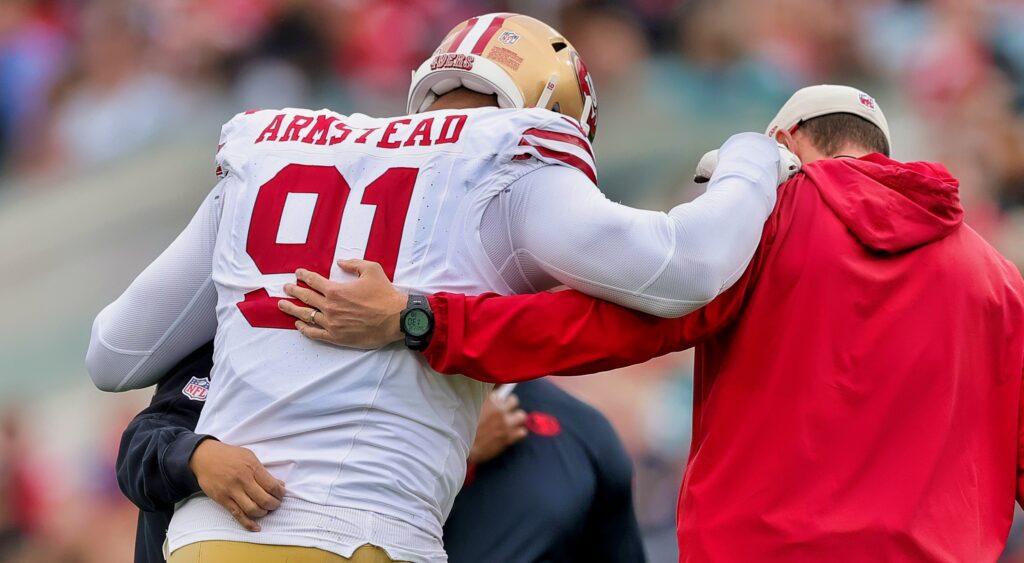 Arik Armstead gets helped off the field.