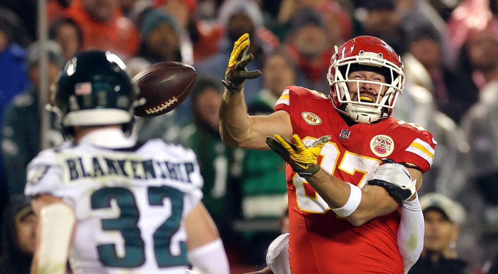 Travis Kelce reacting after failing to make catch during game.