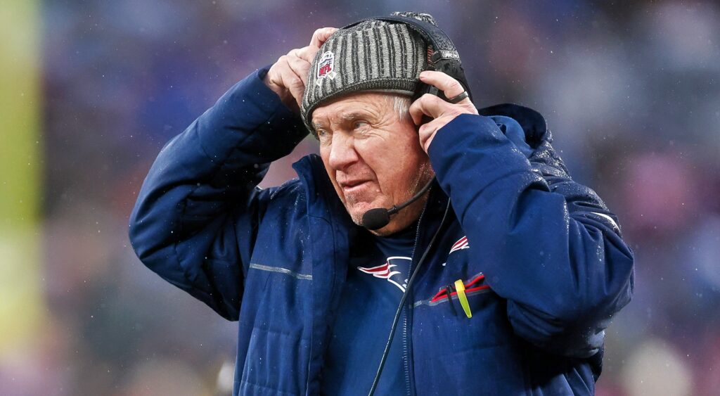 New England Patriots head coach Bill Belichick looking on.