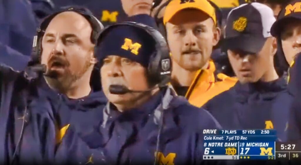 Connor Stalions on sideline with Michigan coaches