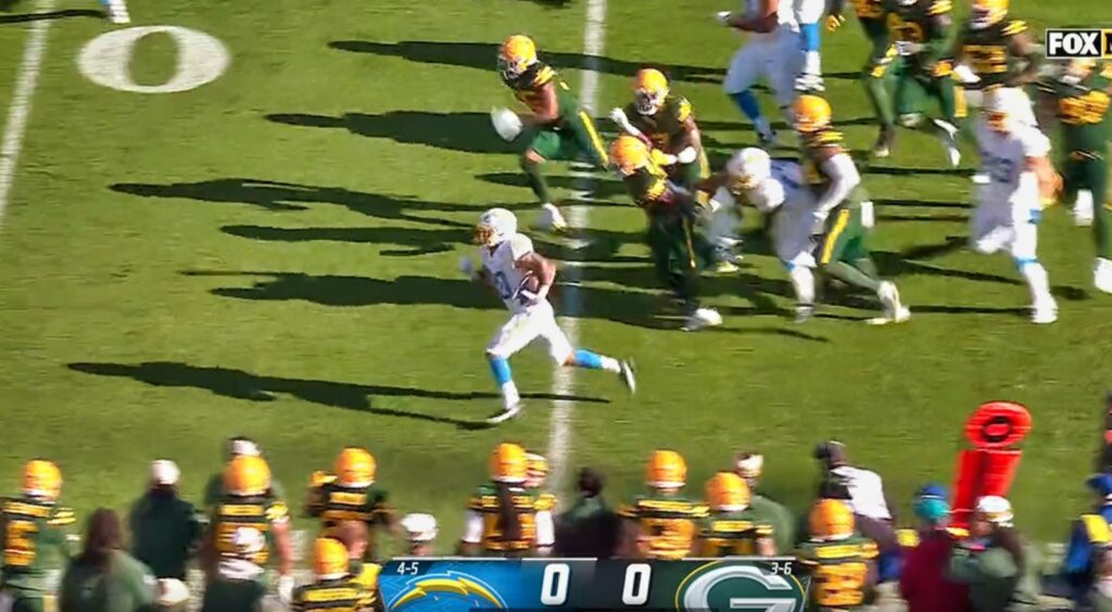 Austin Ekeler running from packers players