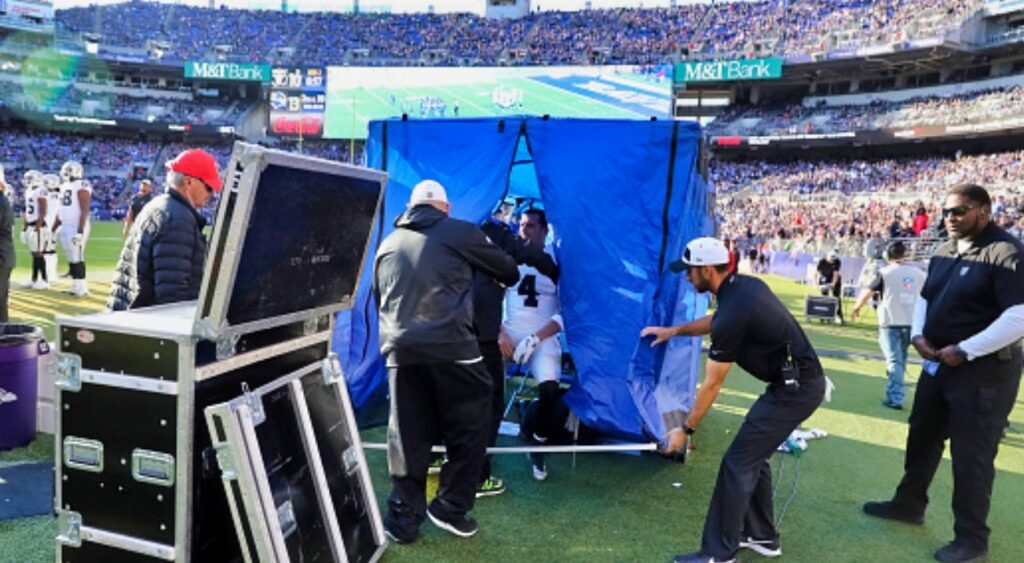 NFL player in the blue medical tent.