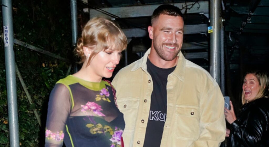 Travis Kelce next to Taylor Swift