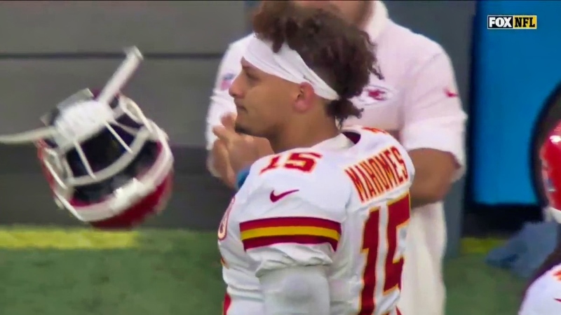 Kansas City Chiefs quarterback Patrick Mahomes looking on.