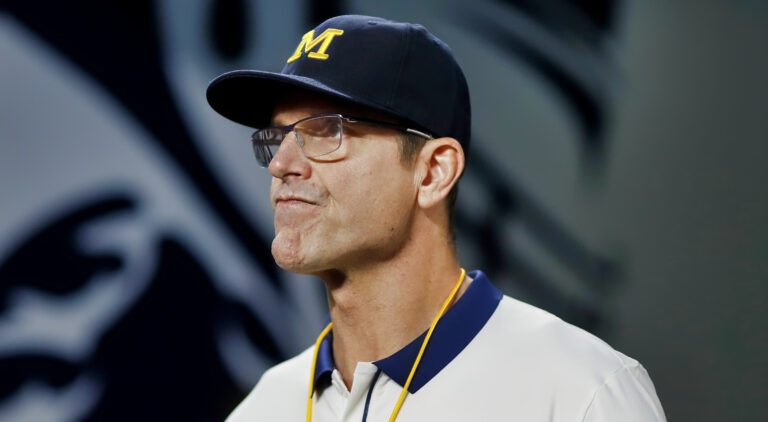 Jim Harbaugh wearing Michigan hat