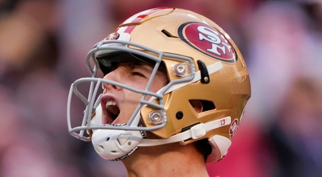 Brock Purdy yells during a game.