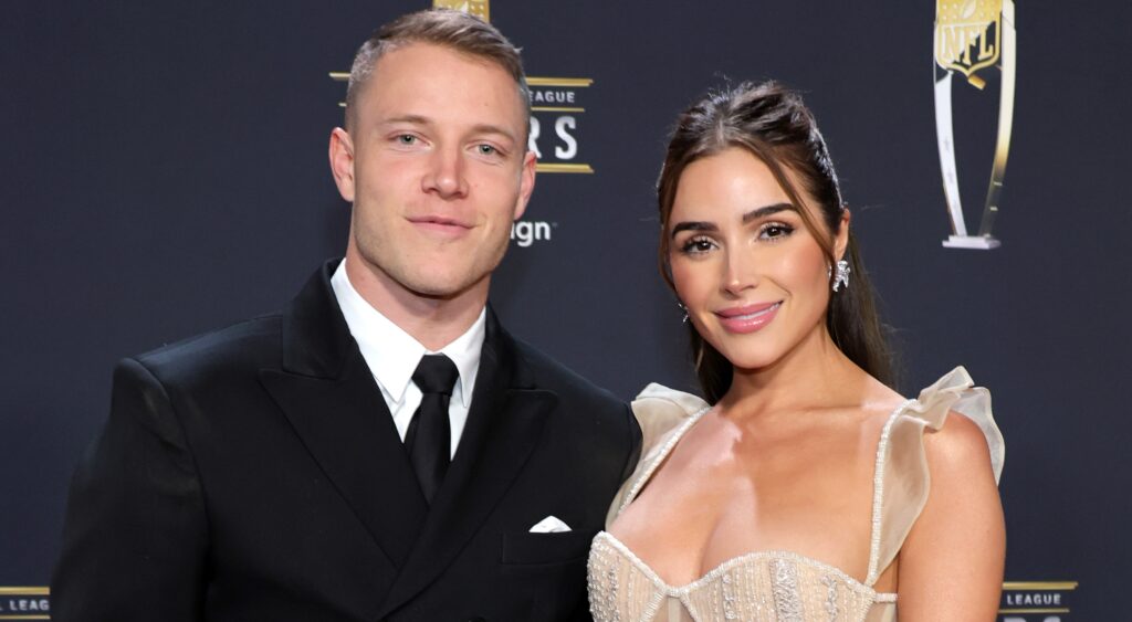 Christian McCaffrey and Olivia Culpo posing