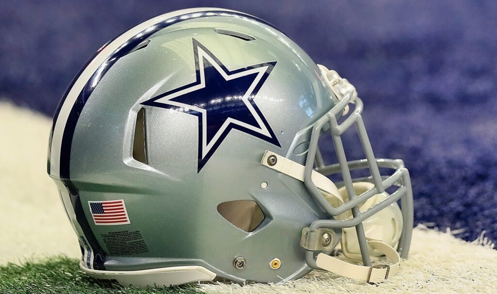 Dallas Cowboys helmet shown on field.